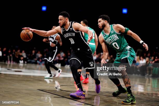 Ben Simmons of the Brooklyn Nets and Jayson Tatum of the Boston Celtics battle for the ball during their game at Barclays Center on January 12, 2023...