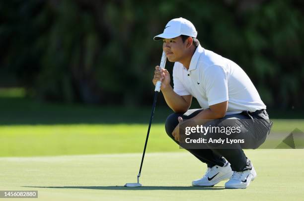 Tom Kim of South Korea lines up a putt on the tenth green during the first round of the Sony Open in Hawaii at Waialae Country Club on January 12,...