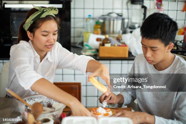 female and male pastry chef preparing cake at home - baking competition stock pictures, royalty-free photos & images