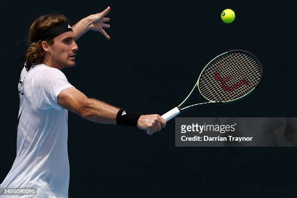 Stefanos Tsitsipas of the Greece plays a backhand shot during a practice session ahead of the 2023 Australian Open at Melbourne Park on January 13,...