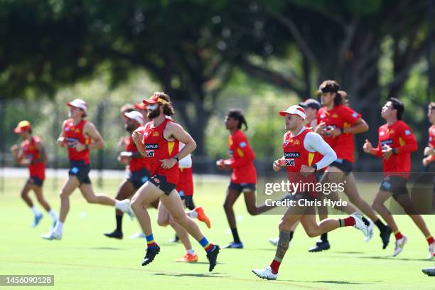 Players run during a Gold Coast Suns AFL training session at Metricon Stadium on January 13, 2023 in Gold Coast, Australia.