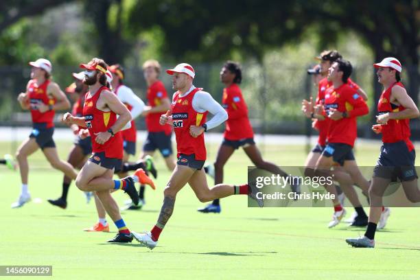 Players run during a Gold Coast Suns AFL training session at Metricon Stadium on January 13, 2023 in Gold Coast, Australia.