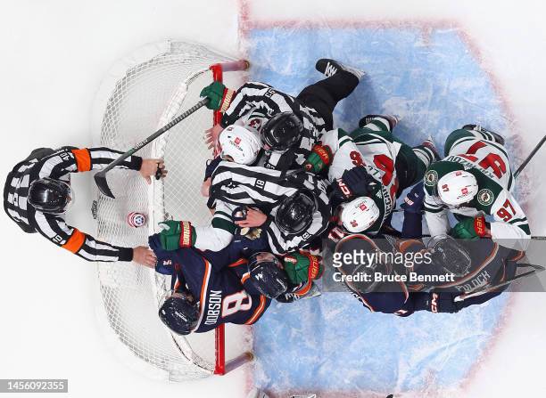 The New York Islanders and Minnesota Wild battle during the second period at the UBS Arena on January 12, 2023 in Elmont, New York. The Wild defeated...