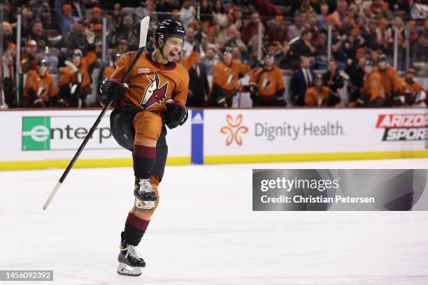 Dylan Guenther of the Arizona Coyotes celebrates after scoring a goal against the Ottawa Senators during the second period of the NHL game at Mullett...