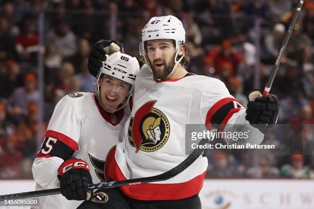 Mark Kastelic of the Ottawa Senators celebrates with Jake Sanderson after scoring a goal against the Arizona Coyotes during the third period of the...