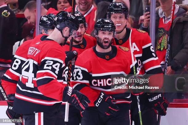Sam Lafferty and Colin Blackwell of the Chicago Blackhawks celebrate a goal against the Colorado Avalanche during the first period at United Center...
