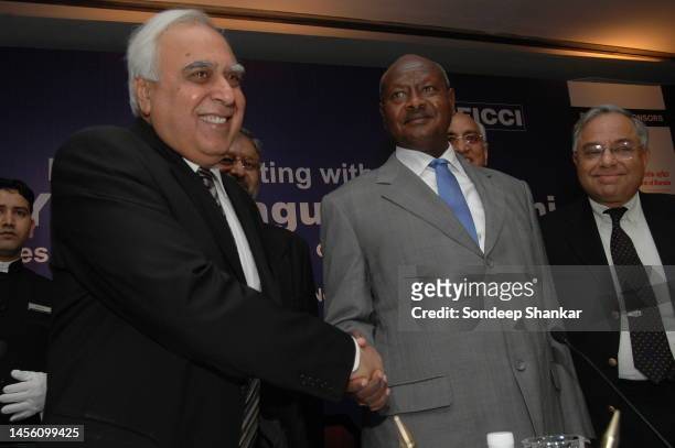 Ugandan President Yoweri Muserveni with India's Minister of Science and Technology Kapil Sibal during a business meeting in New Delhi.