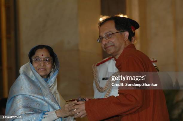 President Pratibha Patil presenting Padma Bhushan a Civilian Honour to Kaushik Basu an Indian economist at the Presidential Palace in New Delhi on...