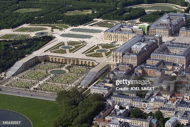 An aerial view taken on June 2 shows the Chateau de Versailles and its gardens, west of Paris, whose construction began in 1661, by architect Louis...