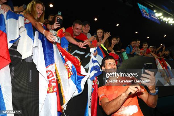 Novak Djokovic of Serbia poses for a selfie with fans after the Arena Showdown charity match against Nick Kyrgios of Australia ahead of the 2023...