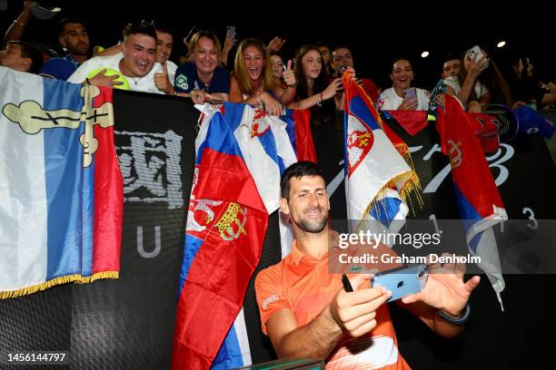 Novak Djokovic of Serbia poses for a selfie with fans after the Arena Showdown charity match against Nick Kyrgios of Australia ahead of the 2023...