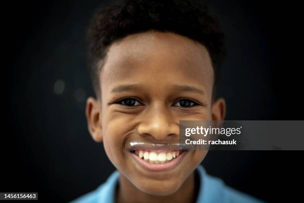 handsome young african boy smiling - kid actor stock pictures, royalty-free photos & images