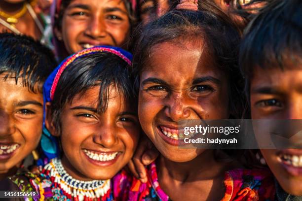 group of happy gypsy indian children, desert village, india - girl traveler stock pictures, royalty-free photos & images