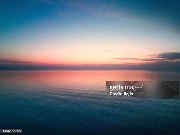 seascape at sunset - zwielicht stock-fotos und bilder