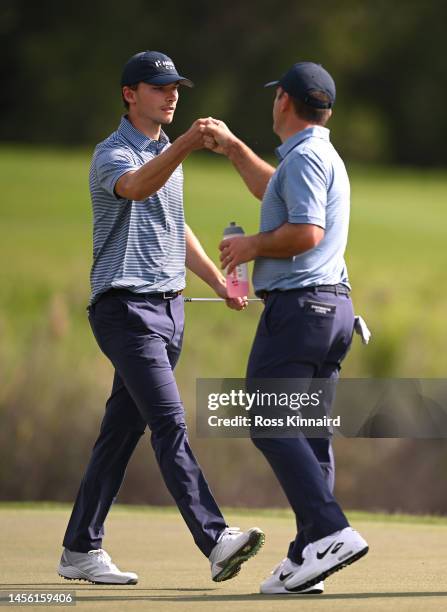 Nicolai Højgaard and Francesco Molinari of Continental Europe fist pump on the seventh green during the Friday Fourball matches of the Hero Cup at...