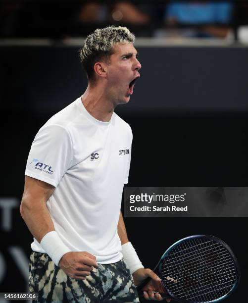 Thanasi Kokkinakis of Australia celebrates a point against Roberto Bautista Agut of Spain during day five of the 2023 Adelaide International at...