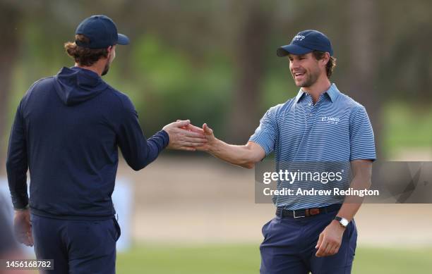 Thomas Pieters and Thomas Detry of Continental Europe congratulate each other after winning their perspective Friday Fourball matches oat the Hero...