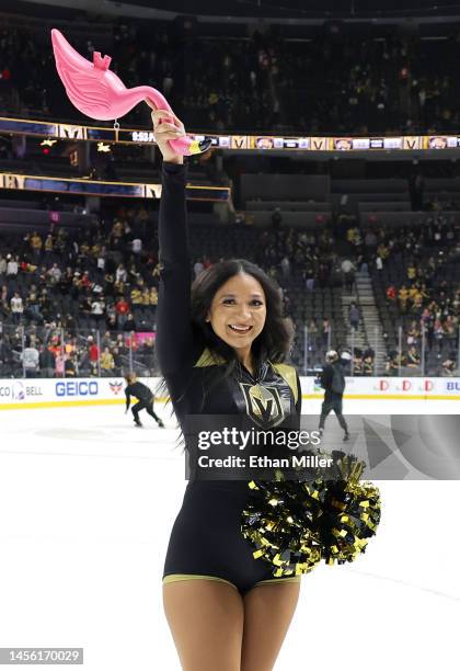 Member of the Knights Guard carries a plastic flamingo thrown onto the ice by a fan after the Vegas Golden Knights' 4-2 victory over the Florida...
