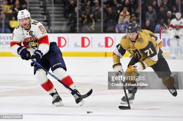 Aleksander Barkov of the Florida Panthers passes against William Karlsson of the Vegas Golden Knights in the first period of their game at T-Mobile...