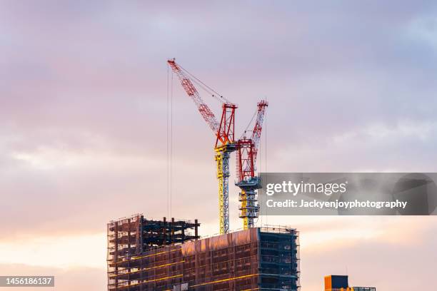 crane on construction site - stockholm landmark stock pictures, royalty-free photos & images