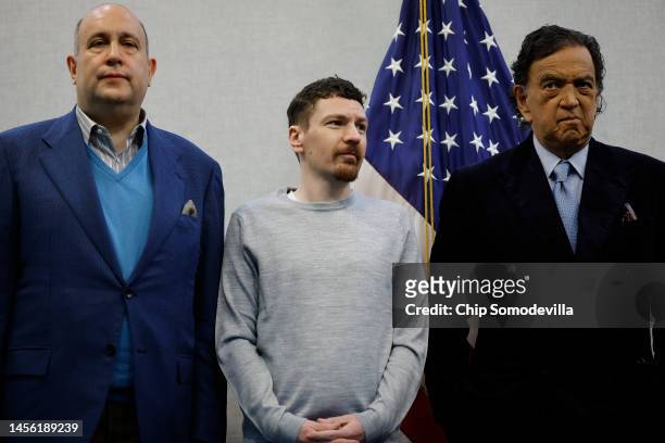Taylor Dudley stands in between Steve Menzies and former U.S. Ambassador to the United Nations Bill Richardson during a news conference at the...