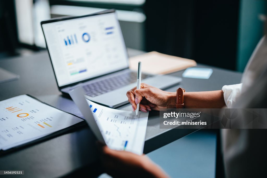 Close Up Photo Of Woman Hands Writing Report On A Paper In The Cafe