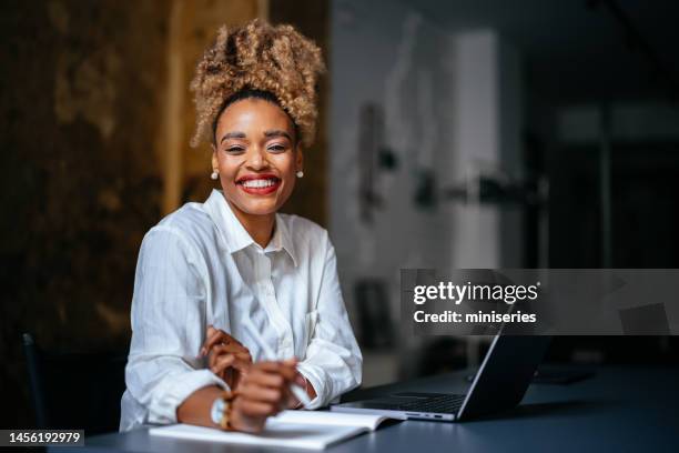 portrait of a smiling businesswoman using a laptop computer in the cafe - draft portraits stock pictures, royalty-free photos & images