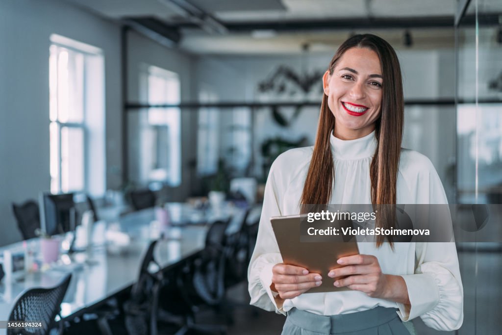 Confident businesswoman in modern office.