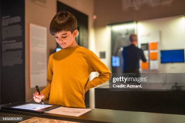 little boy, big knowledge - museum stock pictures, royalty-free photos & images