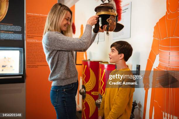 mother and son at a museum event - natural history museum bildbanksfoton och bilder