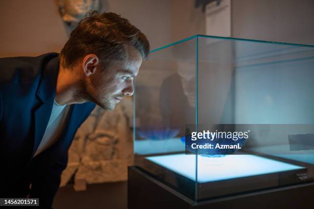 male visitor to the exhibition of ancient roman history - archaeology pottery stock pictures, royalty-free photos & images