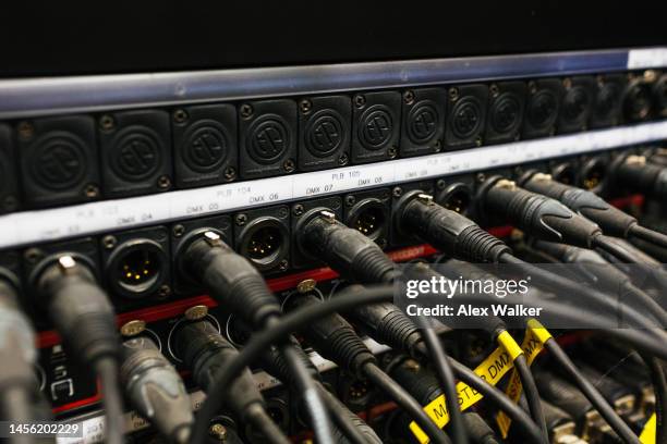 large number of lighting cables plugged into sockets - mainframe computer system stock pictures, royalty-free photos & images