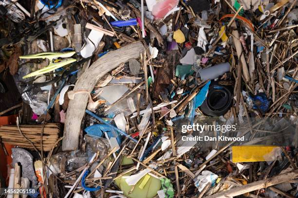 Plastic and other detritus including small plastic pellets known as nurdles line the shoreline of the Thames estuary on January 13, 2023 in Cliffe,...