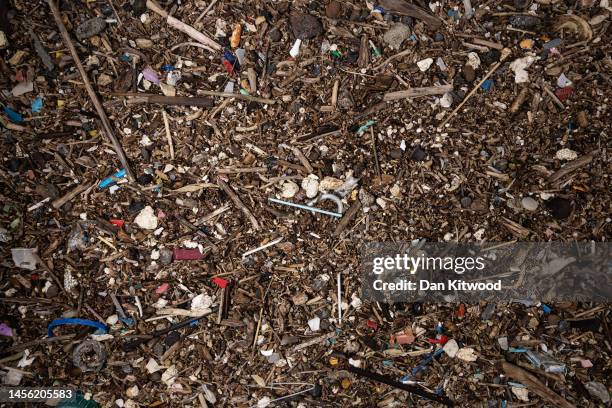 Plastic and other detritus including small plastic pellets known as nurdles line the shoreline of the Thames estuary on January 13, 2023 in Cliffe,...