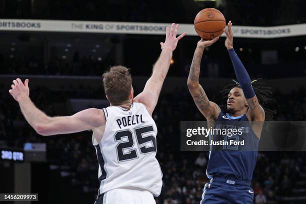 Ja Morant of the Memphis Grizzlies shoots against Jakob Poeltl of the San Antonio Spurs during the game at FedExForum on January 11, 2023 in Memphis,...