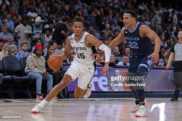 Romeo Langford of the San Antonio Spurs goes to the basket against Desmond Bane of the Memphis Grizzlies during the game at FedExForum on January 11,...
