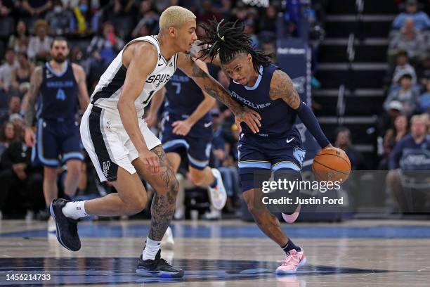 Ja Morant of the Memphis Grizzlies handles the ball during the game against Jeremy Sochan of the San Antonio Spurs at FedExForum on January 11, 2023...