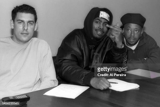 Lyor Cohen, Russell Simmons and Parrish Smith of EPMD appear in a photo as Smith signs a solo artist contract with Def Jam Recordings and flashes the...
