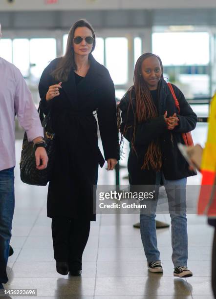 Angelina Jolie and Zahara Pitt-Jolie arrive at JFK Airport on January 13, 2023 in New York City.
