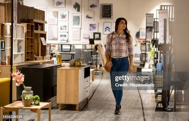 woman shopping at a furniture store - furniture store stockfoto's en -beelden