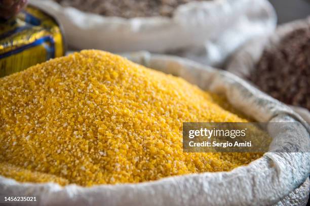 cornmeal on sale at market - cornmeal stock pictures, royalty-free photos & images