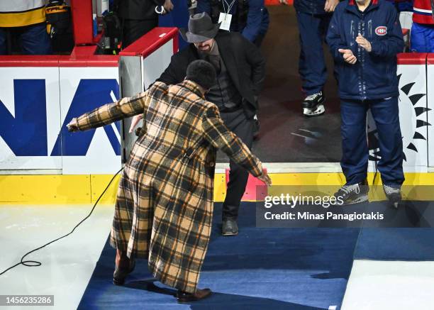 Goaltender Carey Price of the Montreal Canadiens and P. K. Subban perform their post game ritual the triple low five, after being honoured for his...