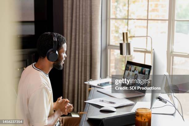 young adult college student talks to peers - work from home stock pictures, royalty-free photos & images