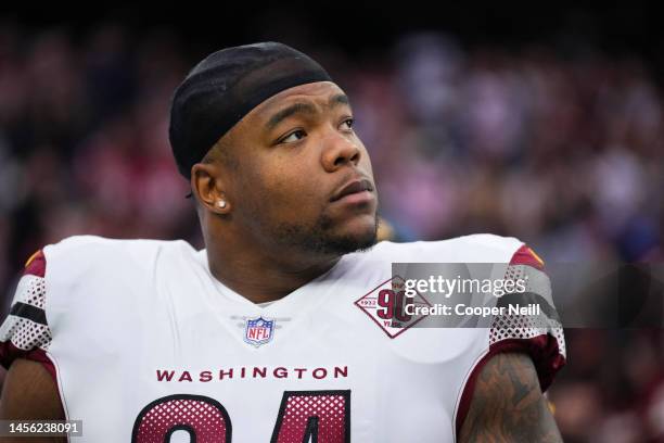 Daron Payne of the Washington Commanders stands during the national anthem against the Houston Texans at NRG Stadium on November 20, 2022 in Houston,...