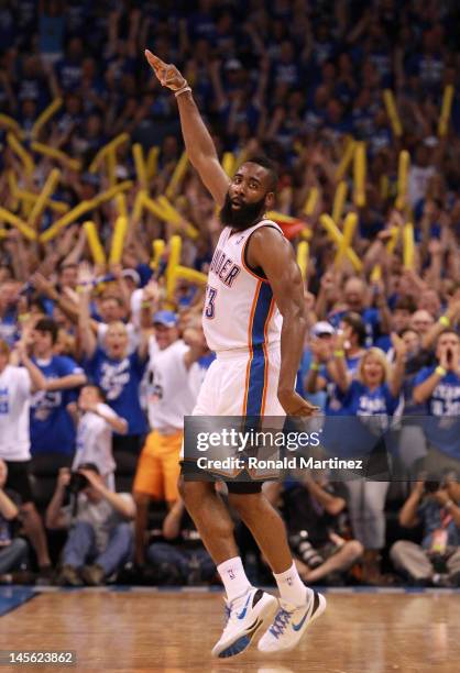 James Harden of the Oklahoma City Thunder reacts after making a three-pointer in the fourth quarter against the San Antonio Spurs in Game Four of the...