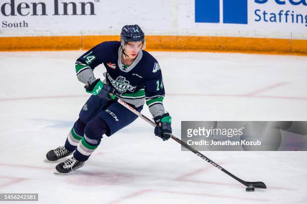 Kevin Korchinski of the Seattle Thunderbirds plays the puck during first period action against the Winnipeg ICE at Wayne Fleming Arena on January 11,...