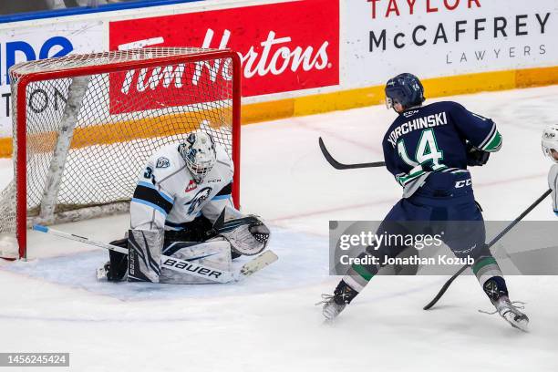 Goaltender Daniel Hauser of the Winnipeg ICE stops a shot by Kevin Korchinski of the Seattle Thunderbirds during action in the overtime period at...