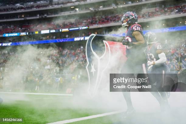 Christian Kirksey of the Houston Texans runs onto the field during introductions against the Washington Commanders at NRG Stadium on November 20,...