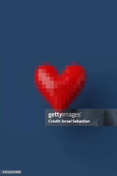 digitally generated image of pixelated red heart on dark blue background. - pixel stock pictures, royalty-free photos & images