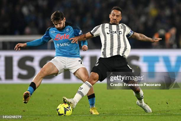 Khvicha Kvaratskhelia of SSC Napoli battles for possession with Danilo of Juventus during the Serie A match between SSC Napoli_Juventus at Stadio...